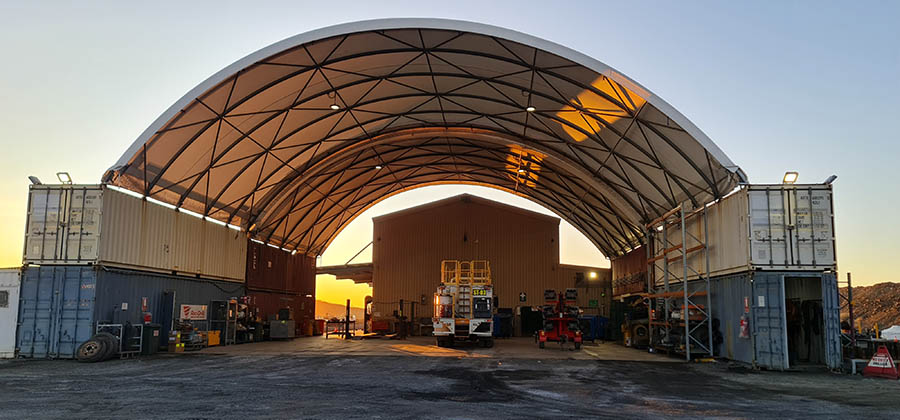 A spacious and durable dome-shaped shelter, ideal for industrial and workshop applications.