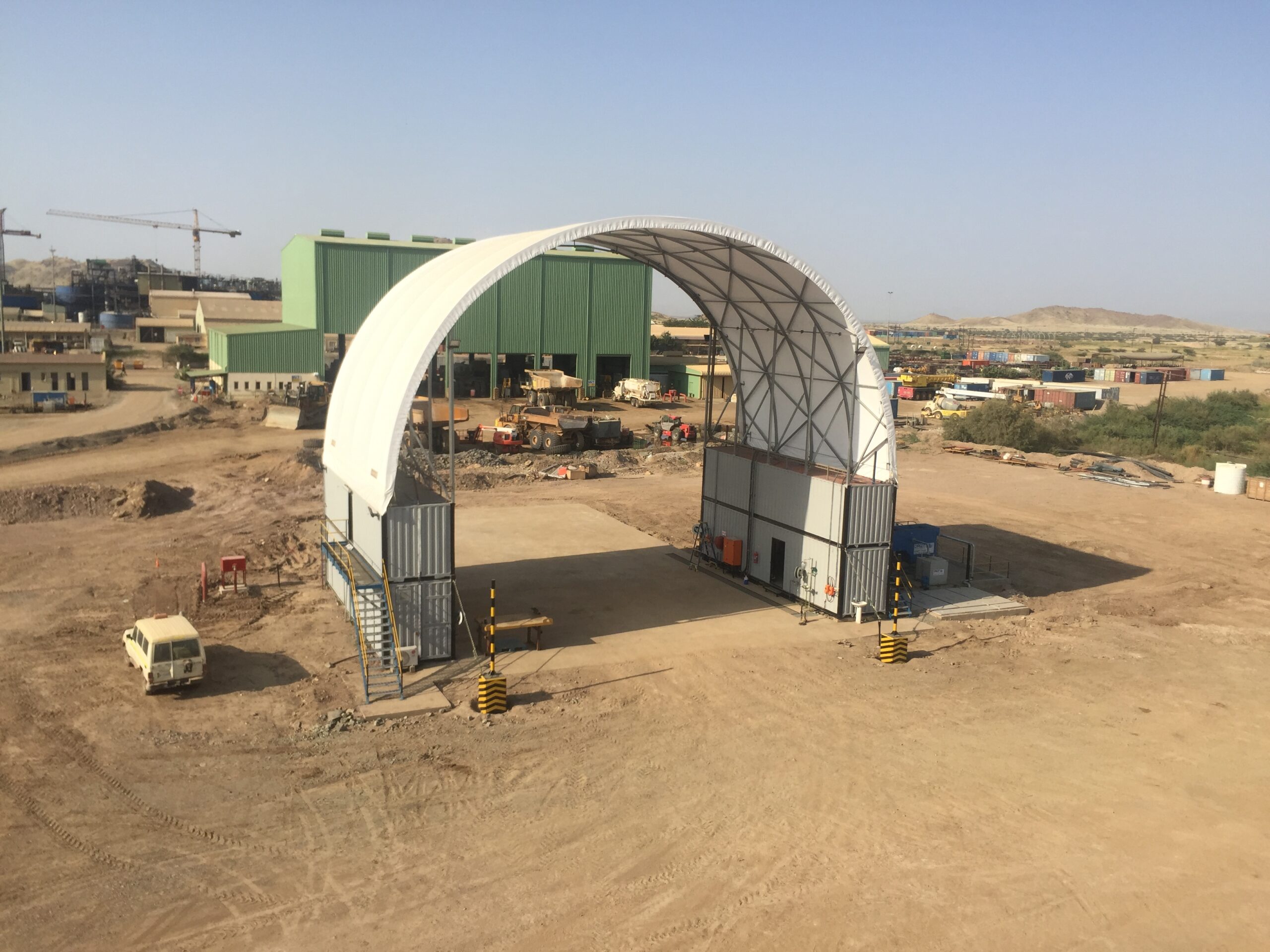 A large dome structure designed for truck maintenance at the Bisha Mining site.