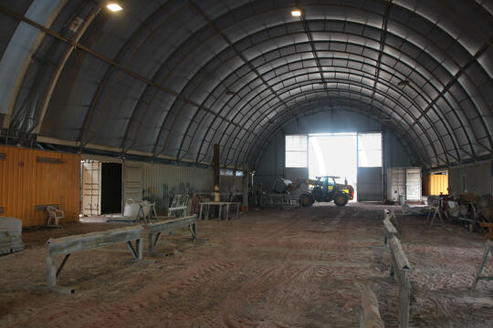 Image of an Allshelter Container Shelter with doors used as a sand blasting & paint facility